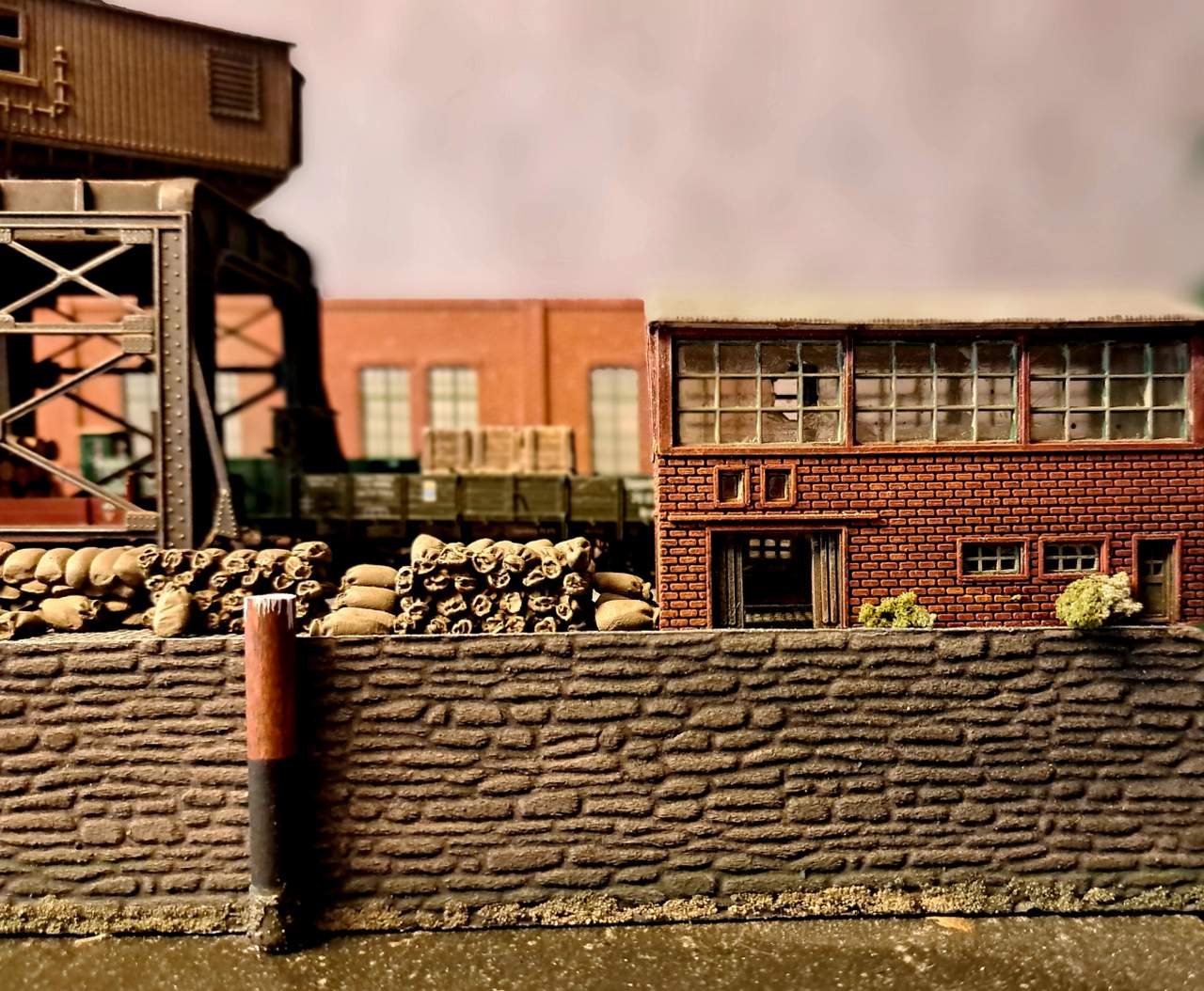 From the nearby workshops of the Harris Shipyard come the dull, rhythmic blows of steam-driven machinery.