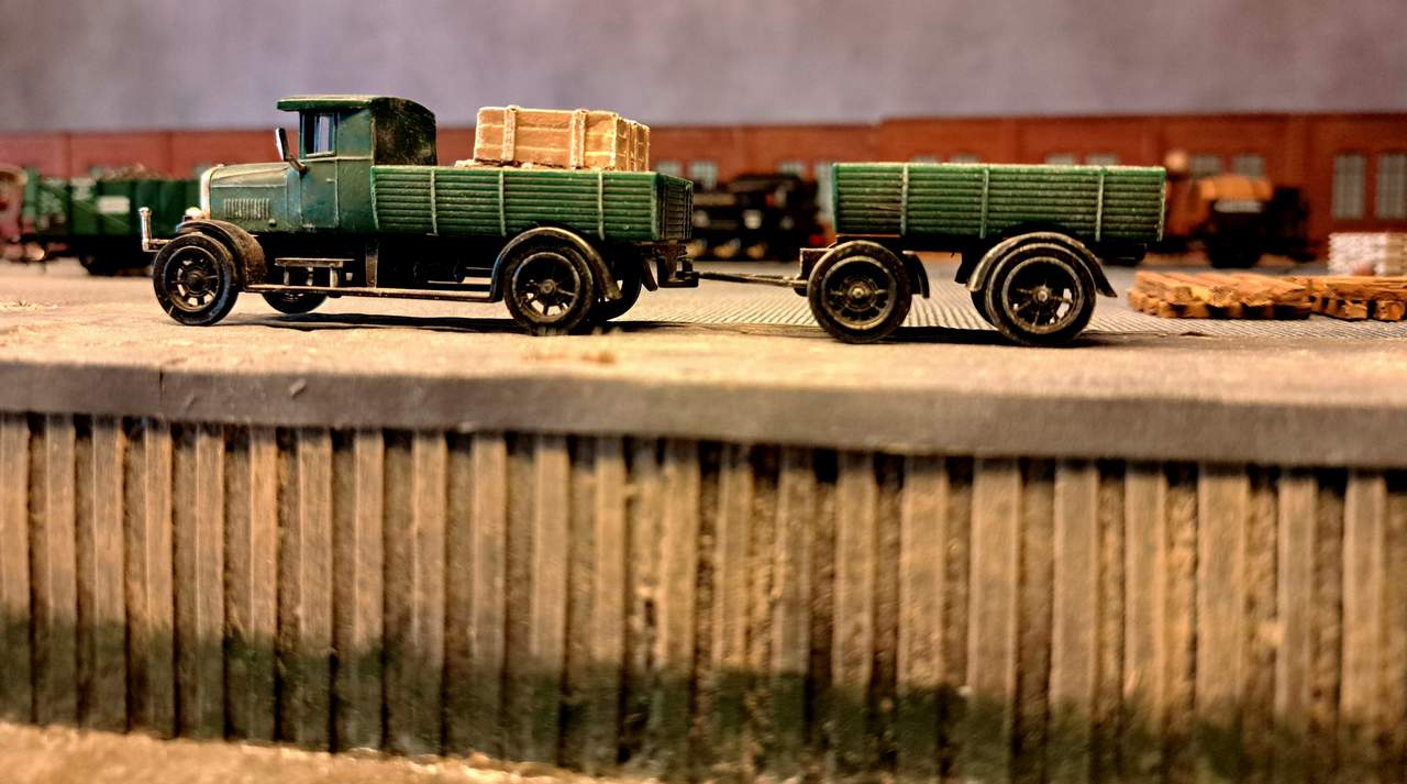 With growing impatience, the lorrymen await their turn to have their vehicles loaded